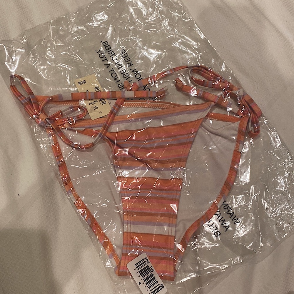 Low rise, Classic Coverage, Side Tie bikini bottom never worn, still in bag.